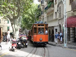 Historic tram on a city street in Sóller.